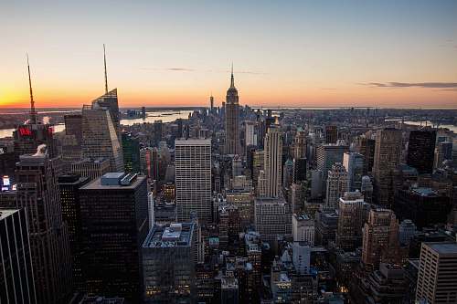 new york aerial photography of high-rise buildings during sunset skyscraper